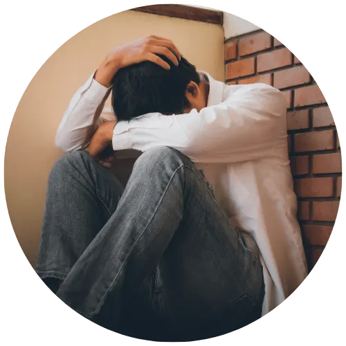 Man holding head showing stress linked to ADHD symptoms