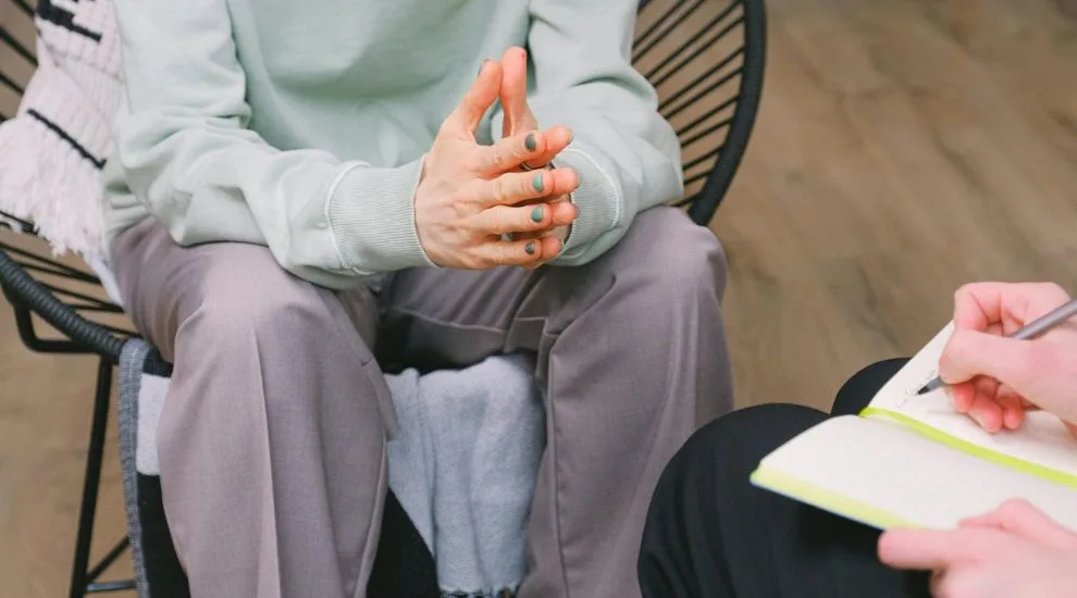 Individual in an ACT therapy consultation.